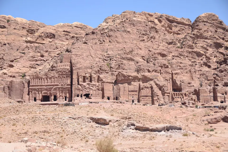 The Royal Tombs carved into the pink sandstone mountainside above the valley at Petra