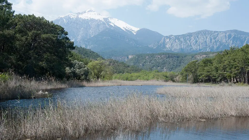 Reed-fringed lagoon at Phaselis, south of Kemer, below the snow-capped Taurus Mountains