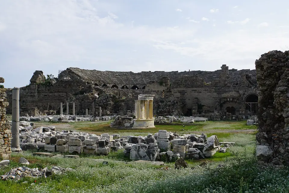 The Roman theatre of ancient Side seen across excavated ruins and grass