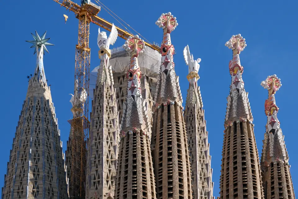 Spires of the Sagrada Família against a blue sky