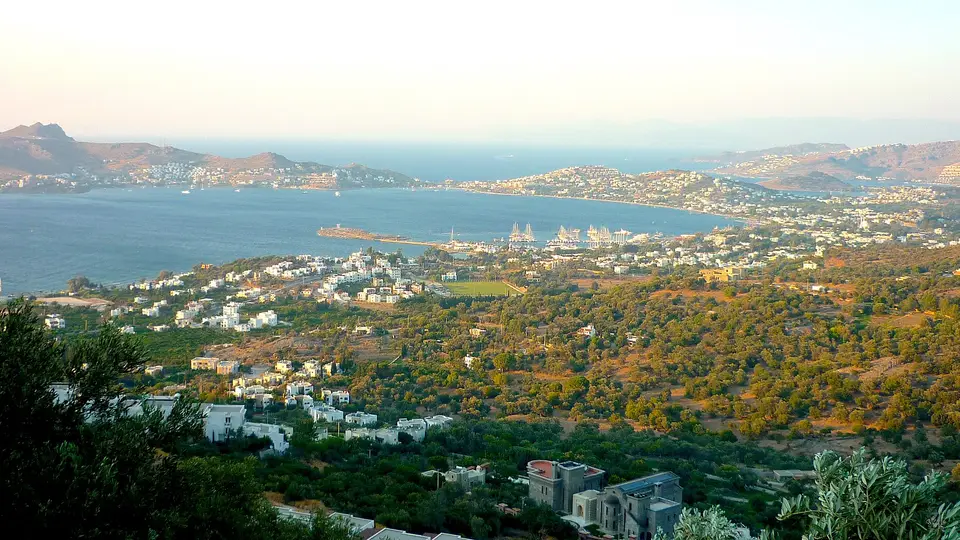 Yalıkavak bay seen from the hills to the south, with white villas and the sea beyond