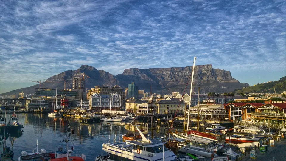 Boats moored in the V&A Waterfront marina below Table Mountain in early morning light