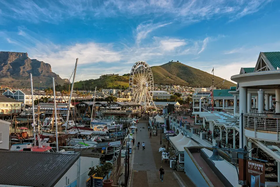 The V&A Waterfront promenade and Ferris wheel with Signal Hill and Table Mountain behind