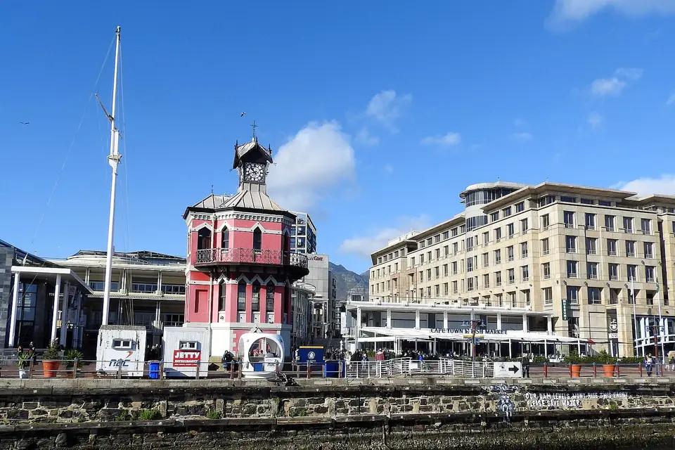 The red Victorian Clock Tower beside the harbour at the V&A Waterfront, Cape Town