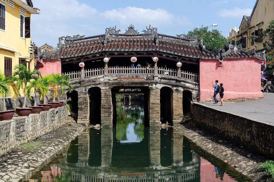 The Japanese Covered Bridge in Hoi An Ancient Town, its tiled roof spanning a narrow canal