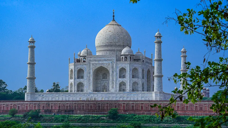 The Taj Mahal seen across the Yamuna from the Mehtab Bagh gardens in Agra