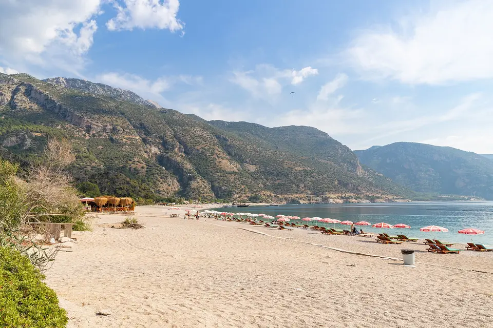 The sandy beach at Ölüdeniz near Fethiye with Babadağ mountain rising behind it