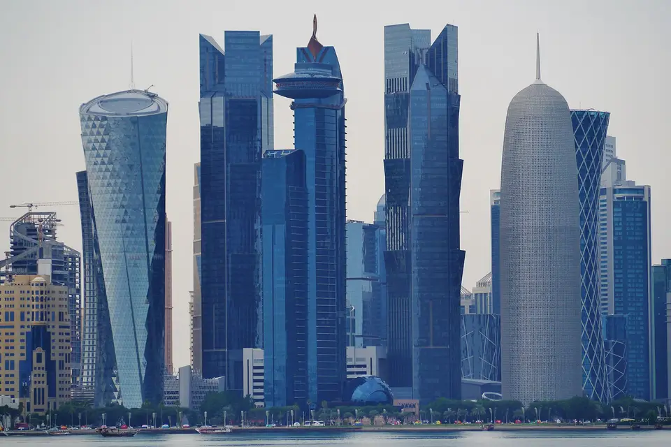 Glass towers of West Bay, including the rounded Doha Tower, seen across the bay