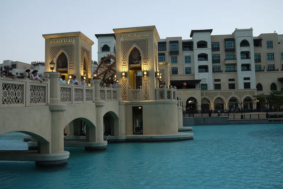Arched footbridge leading across the lake to Souk Al Bahar in Downtown Dubai