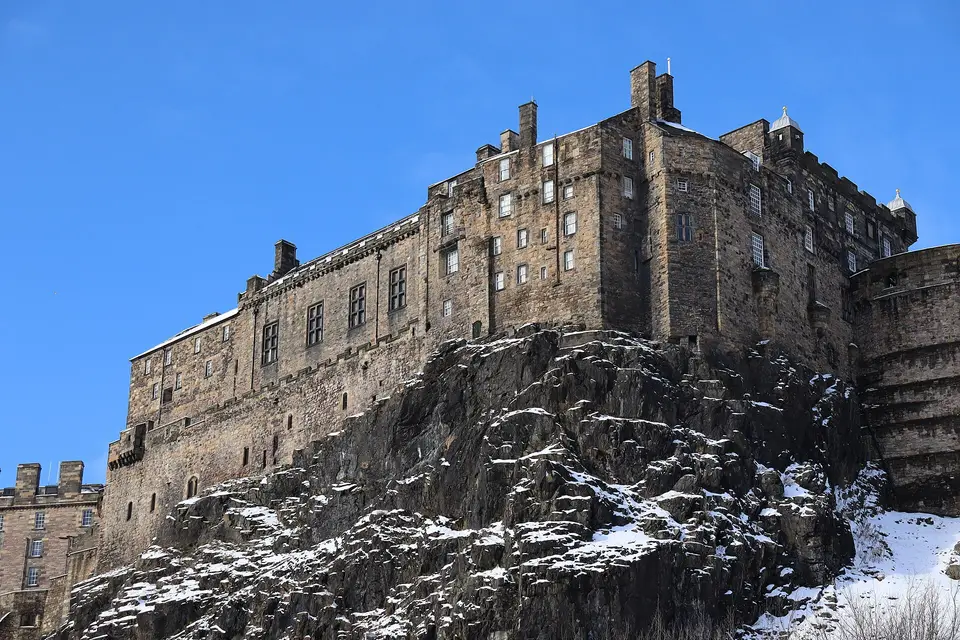The south side of Edinburgh Castle on its rock with a dusting of snow