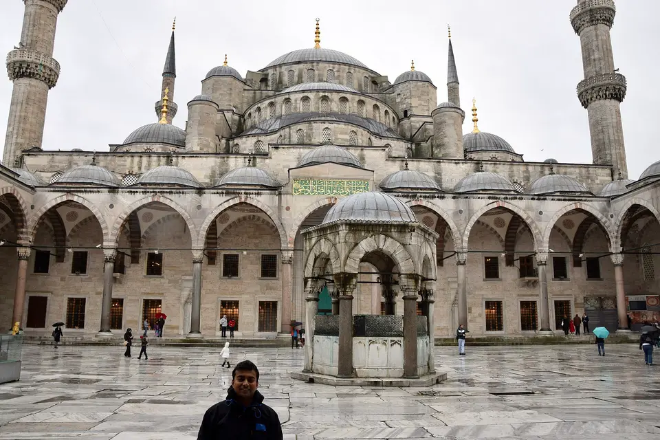 The arcaded courtyard and cascading domes of the Blue Mosque in Istanbul
