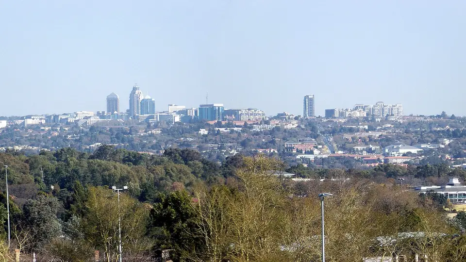 The Sandton skyline rising above the tree-covered northern suburbs of Johannesburg
