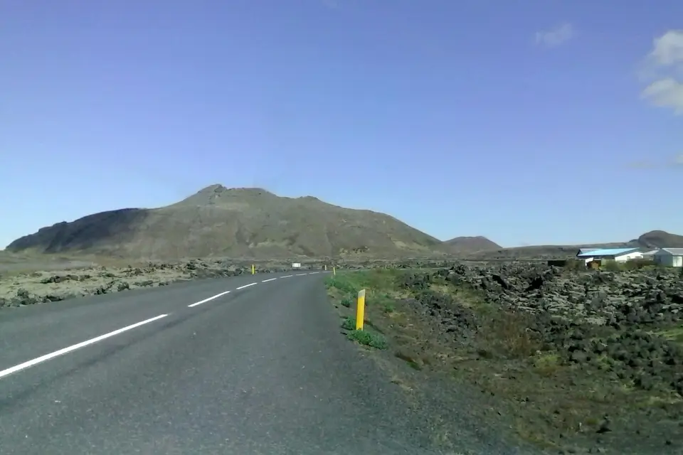 The road through moss-covered lava towards Svartsengi, with Þorbjörn mountain ahead