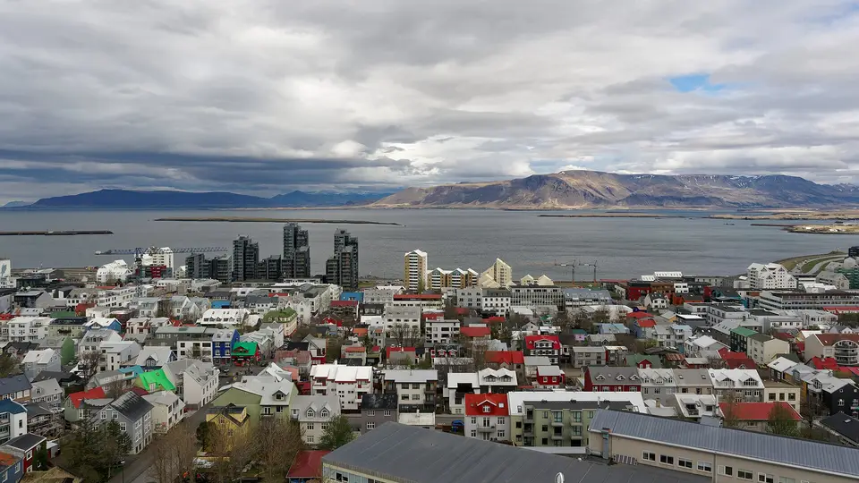 Colourful rooftops of central Reykjavík with the bay and Esja mountains beyond