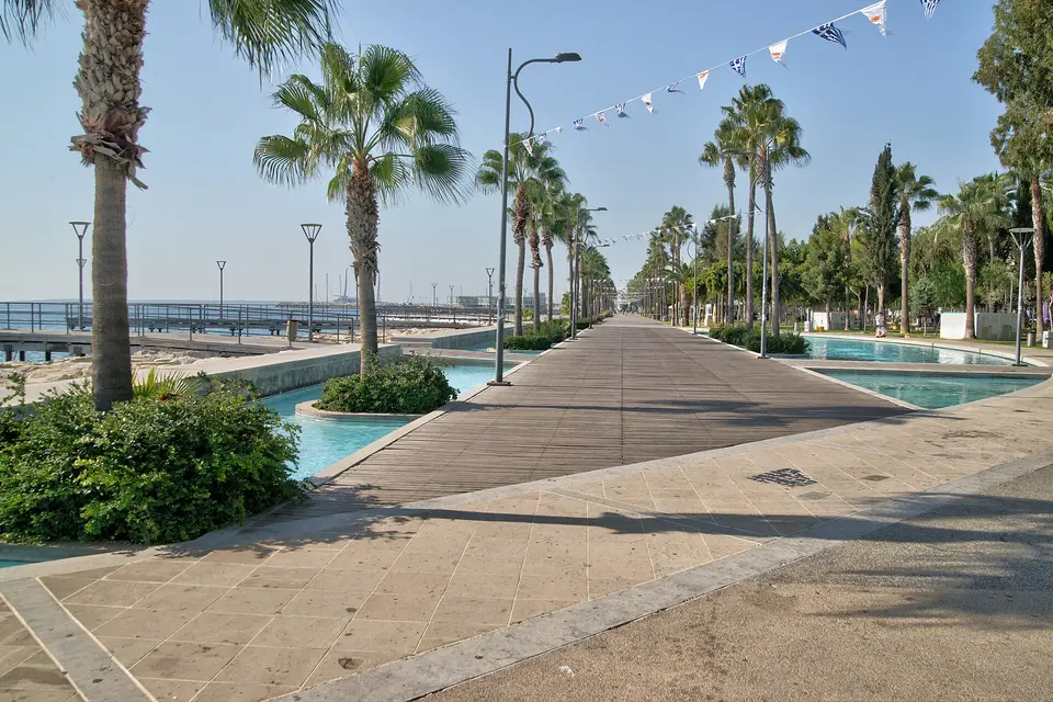The palm-lined Molos promenade with shallow pools beside the sea in Limassol