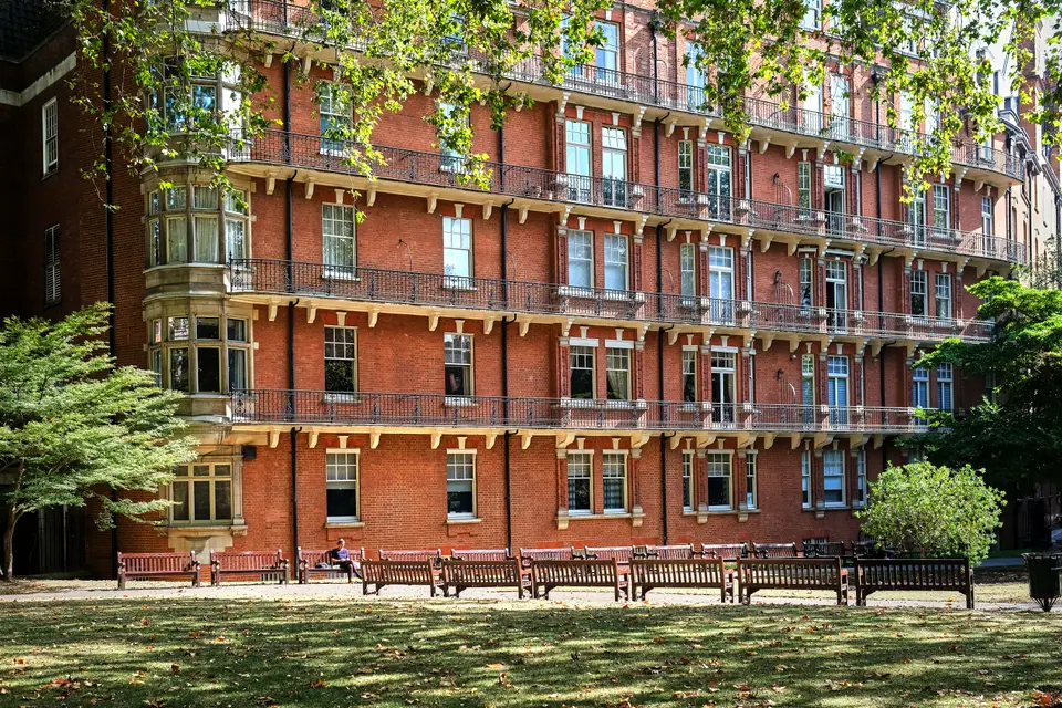Red-brick mansion blocks beside Mount Street Gardens in Mayfair