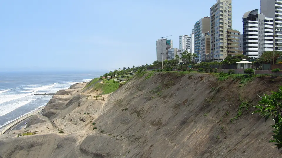 Apartment towers along the top of the green-edged cliffs above the Pacific in Miraflores, Lima