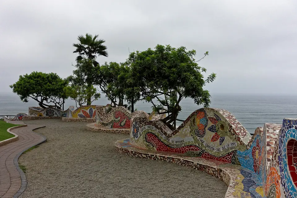 Curving mosaic benches and trees overlooking the Pacific in Parque del Amor, Miraflores