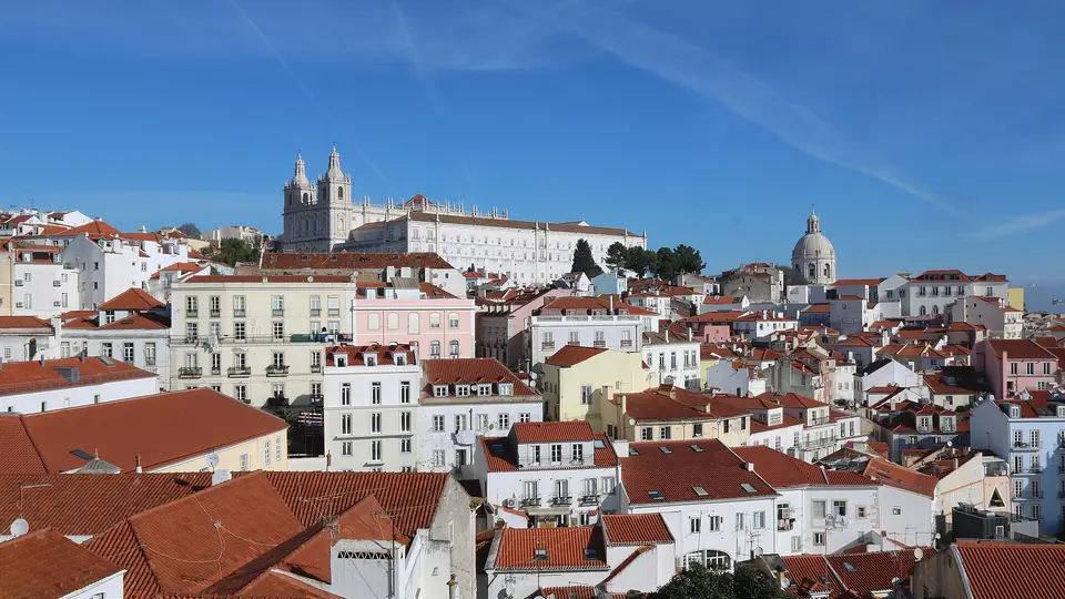 The rooftops of Alfama and the São Vicente de Fora monastery seen from Santa Luzia in Lisbon