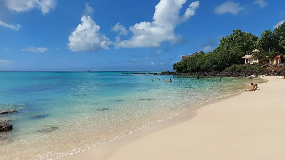 Clear turquoise water and white sand at La Cuvette beach in Grand Baie