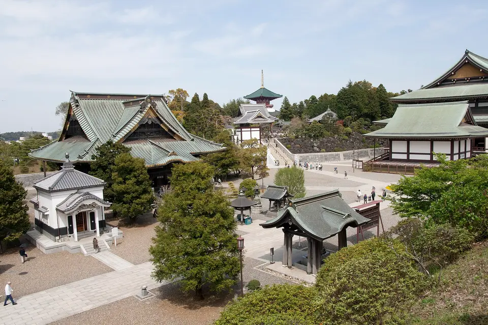 Halls and pagoda of Naritasan Shinshō-ji temple among trees in Narita, near the airport