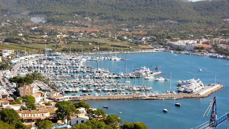 Yachts filling the marina of Port d'Andratx below pine-covered hills on Mallorca's southwest coast