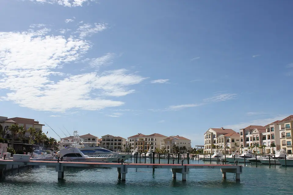 Sport-fishing yachts moored at the jetties below the town houses of Cap Cana marina
