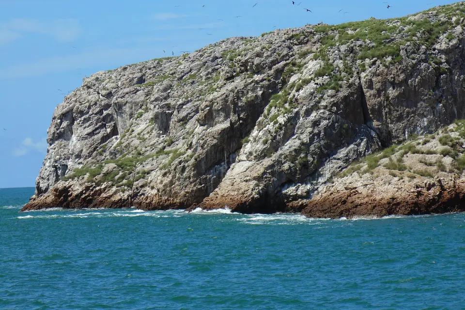 A rocky, bird-covered island of the Islas Marietas off the tip of Punta Mita