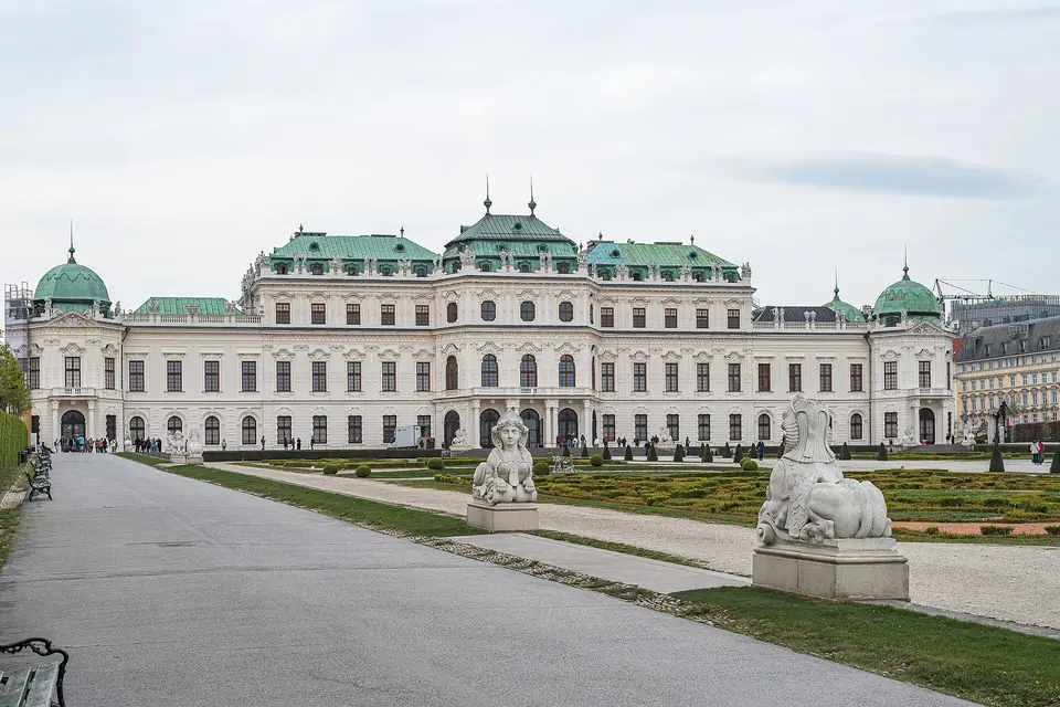 The Upper Belvedere palace with green copper domes, seen across its garden with sphinx statues