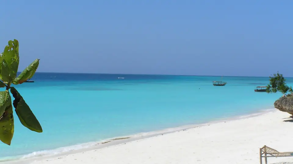 White sand and turquoise shallows along the beach at Nungwi on the northern tip of Zanzibar